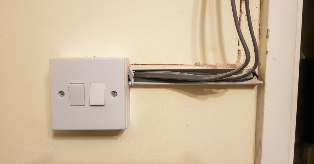 Electrical Rewiring In Progress On A Light Switch